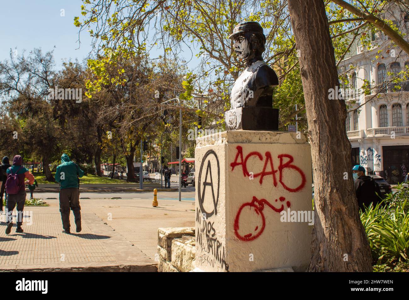 Santiago, Chile - Oct 2, 2021: Vandalized statue at Pro immigration march Stock Photo