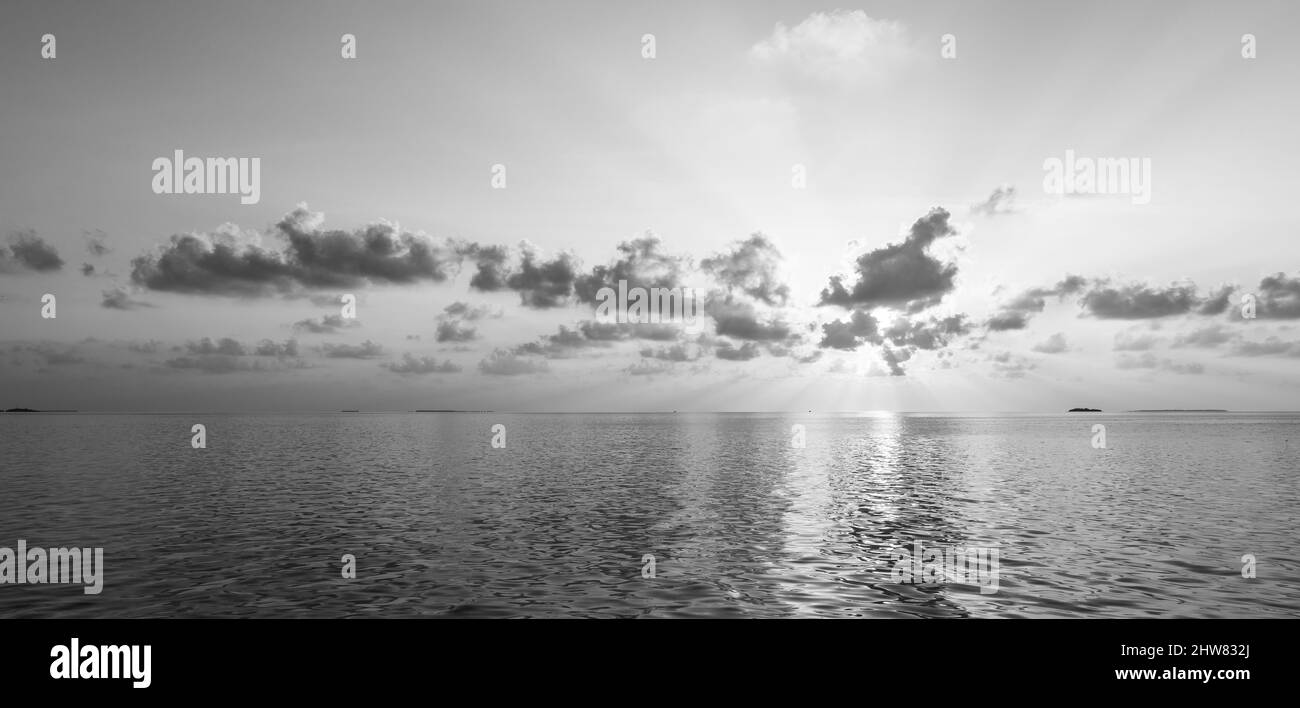 Black and white sunset over the ocean Stock Photo - Alamy