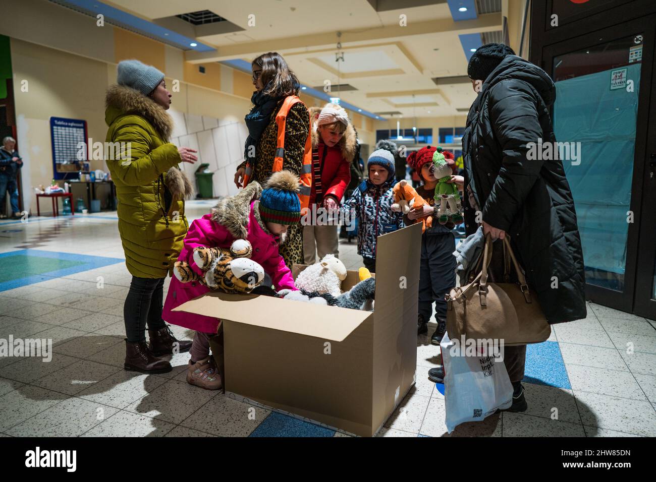 Polish volunteers distribute soft toys to Ukrainian children inside the