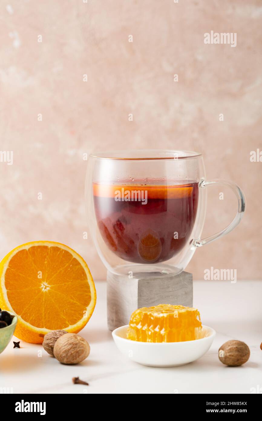 Black tea with fruits spice and honey Stock Photo