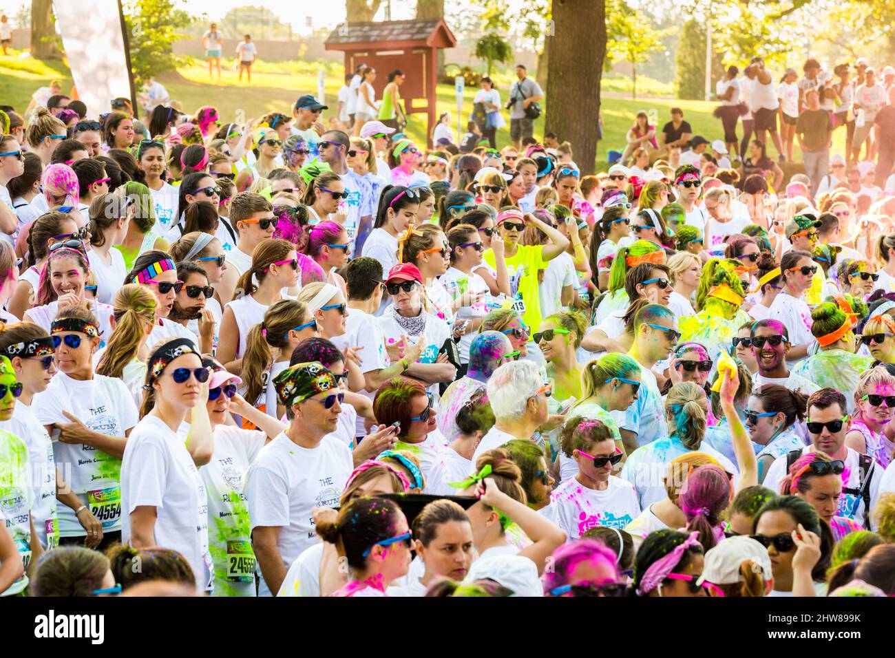 Runners wait for the start of the Color Vibe race Stock Photo