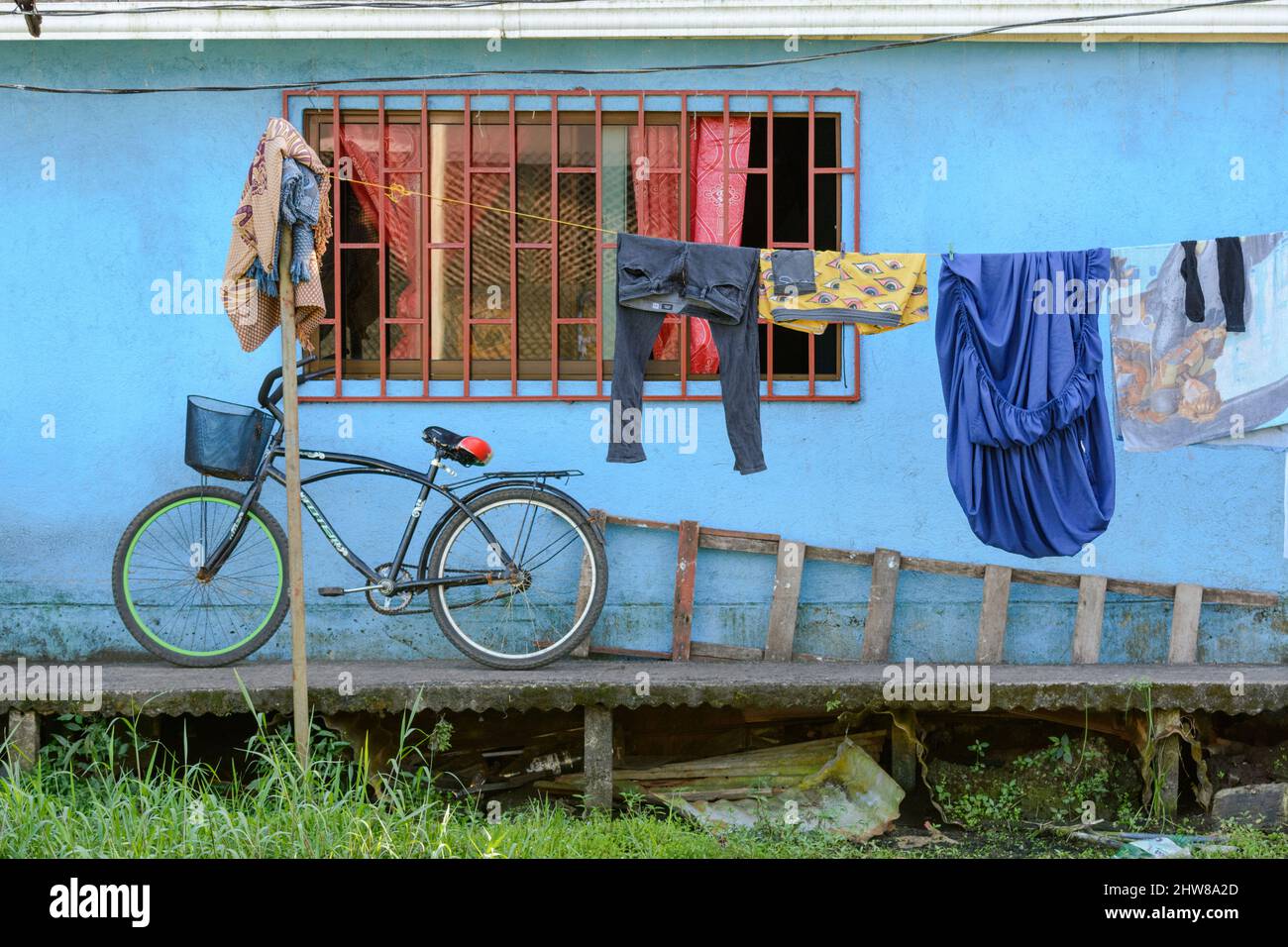 Washing hanging outside a house in the village of Tortuguero, Limon Province, Costa Rica, Central America Stock Photo