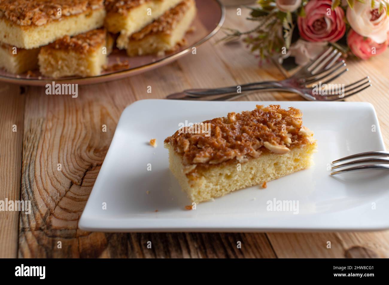 Butter cake with caramelized almonds Stock Photo