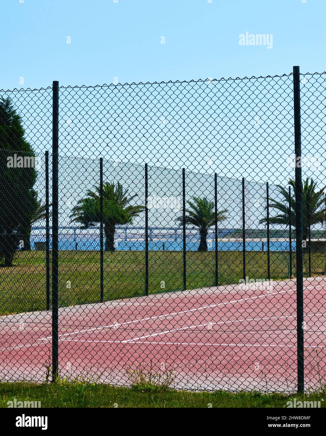 View of a basketball court in a park near the water channels in Ria de