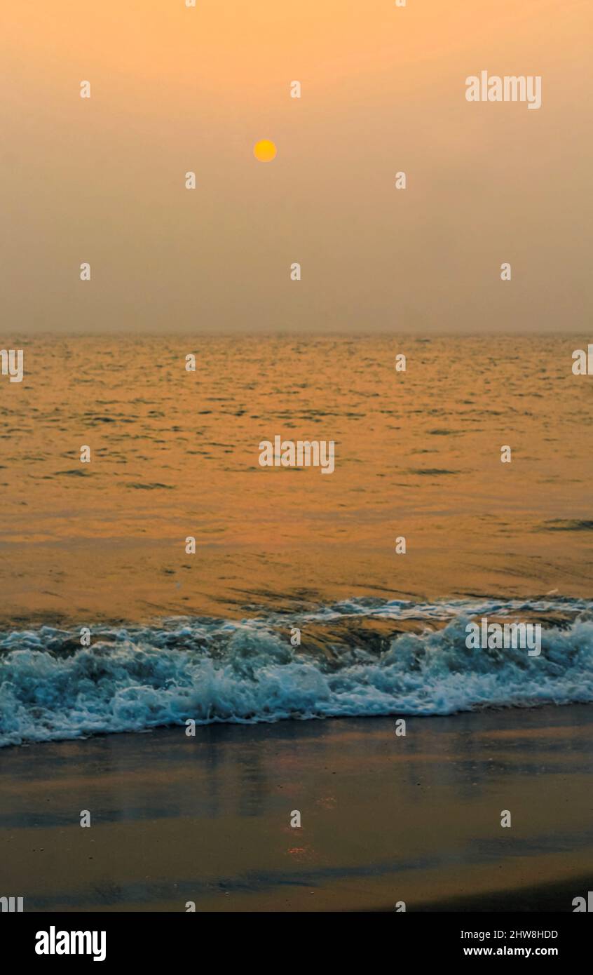 Incredibly beautiful sunset on the beach. Sun, sky, sea, waves and sand ...