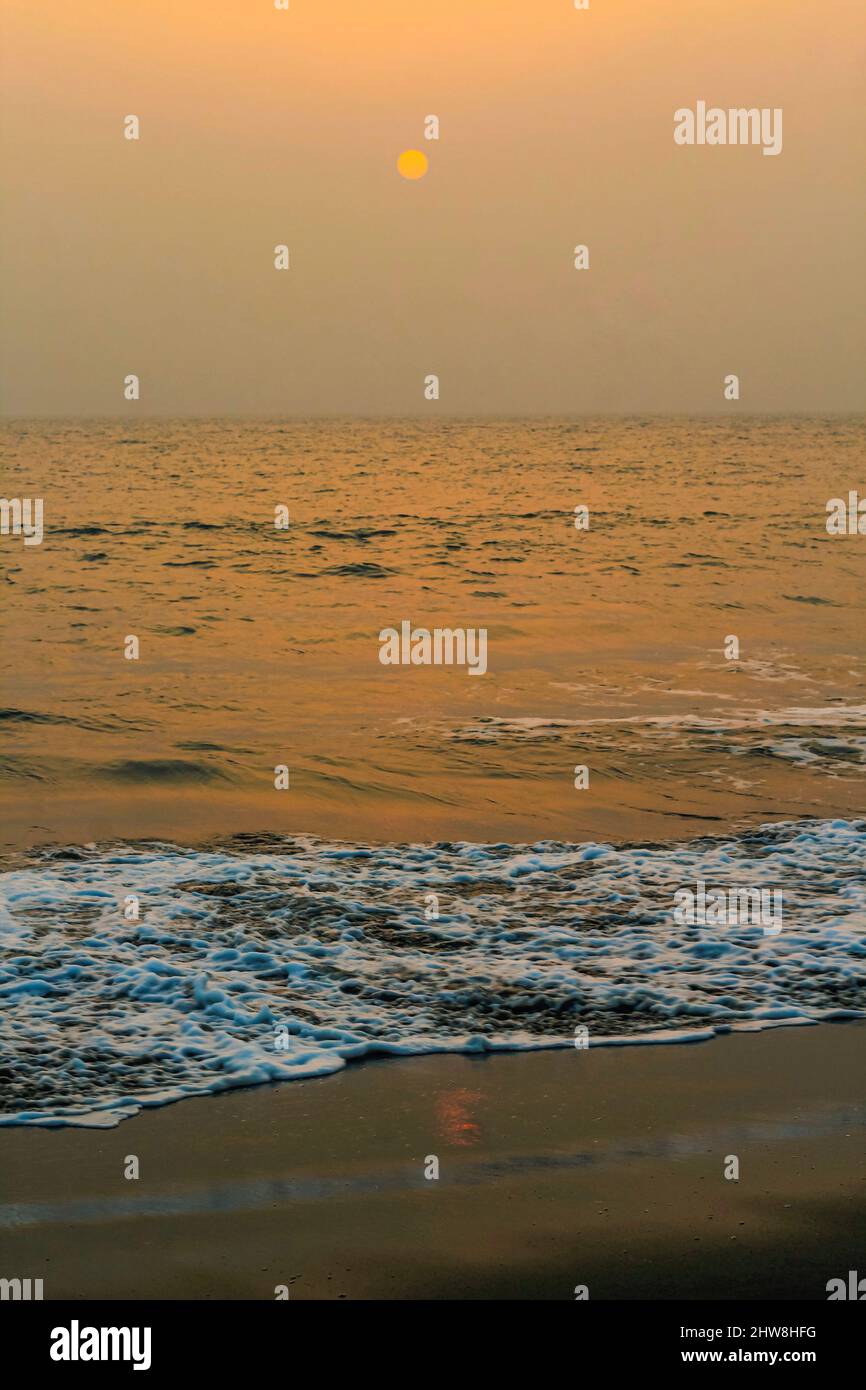 Incredibly beautiful sunset on the beach. Sun, sky, sea, waves and sand ...