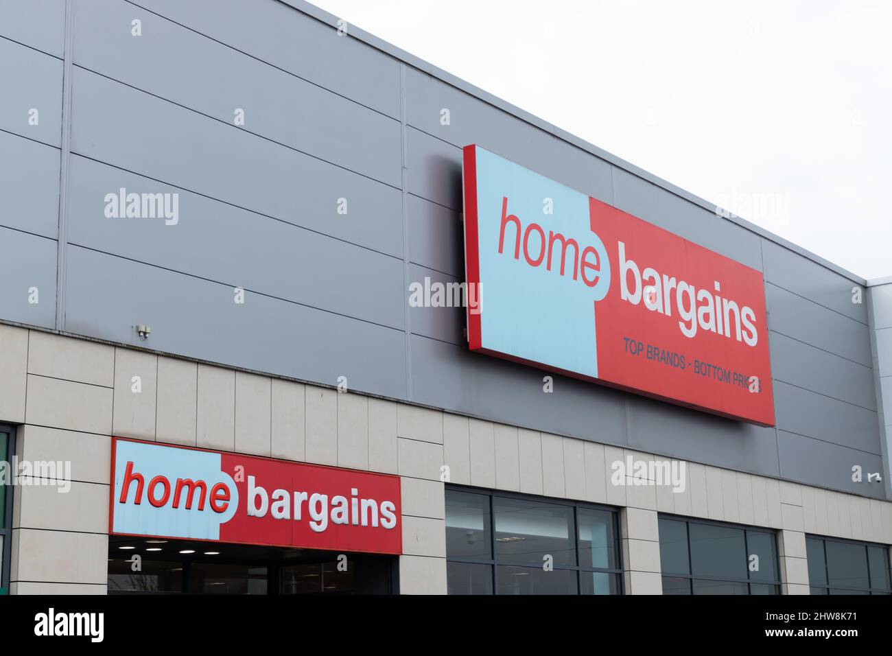 The store frontage and logo of UK bargain shop, Home Bargains at the Merry Hill Centre near Brierley Hill in the UK Stock Photo