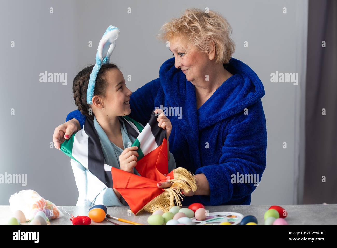 grandmother and granddaughter with uae flag for easter Stock Photo