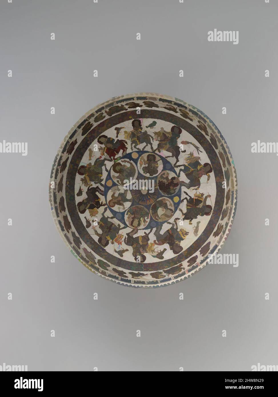 Art inspired by Bowl with Courtly and Astrological Motifs, late 12th–early 13th century, Attributed to Central or Northern Iran, Stonepaste; polychrome inglaze and overglaze painted and gilded on opaque monochrome glaze (mina'i), H. 3 3/4 in. (9.5 cm), Ceramics, The figures and, Classic works modernized by Artotop with a splash of modernity. Shapes, color and value, eye-catching visual impact on art. Emotions through freedom of artworks in a contemporary way. A timeless message pursuing a wildly creative new direction. Artists turning to the digital medium and creating the Artotop NFT Stock Photo
