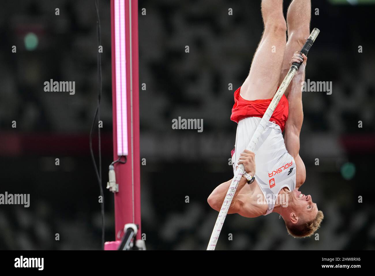 Piotr Lisek participating in the Tokyo 2020 Olympics in the pole vault discipline Stock Photo