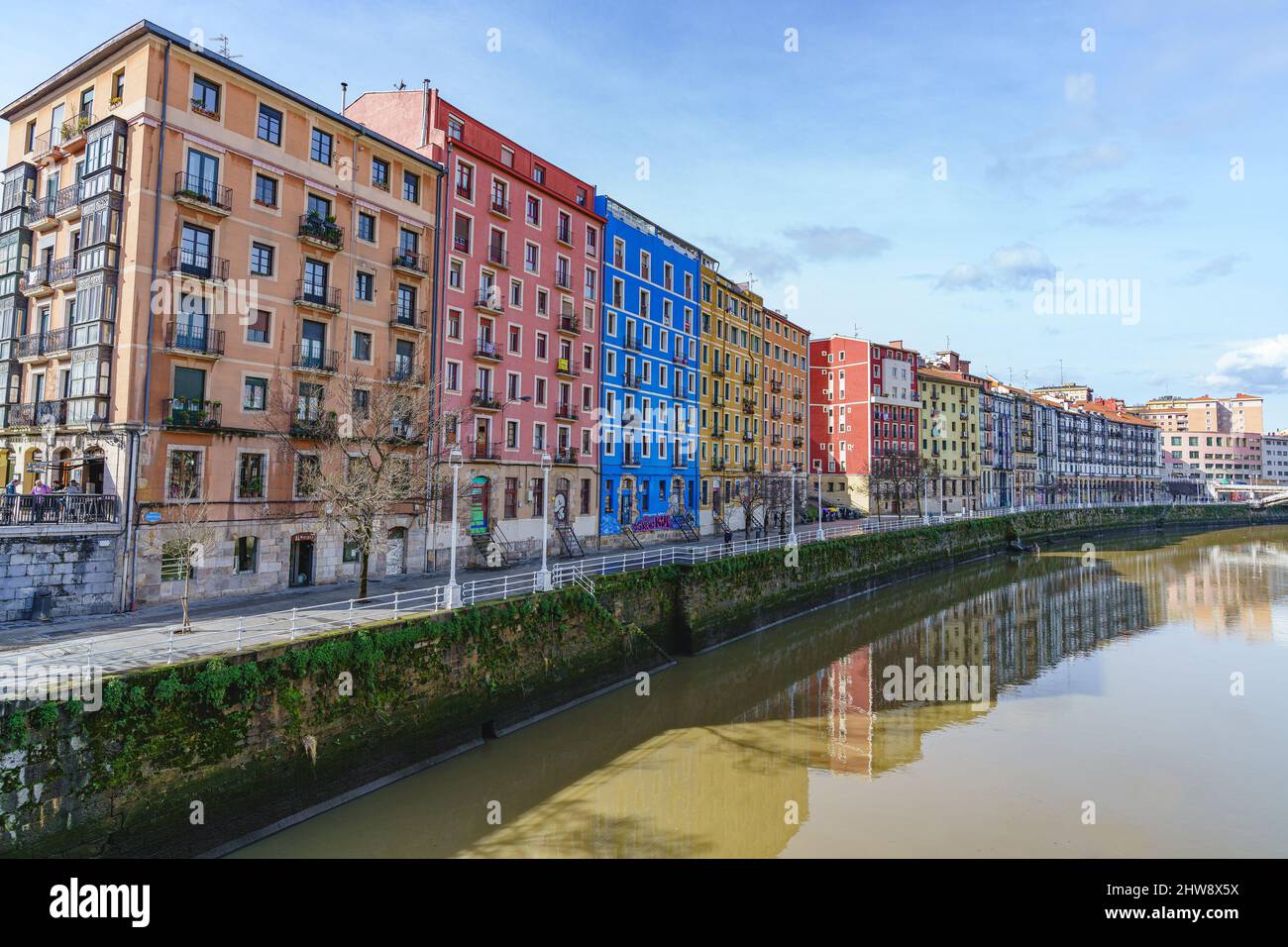 Bilbao, Spain, February 15, 2022. Typical buildings on the banks of the ...