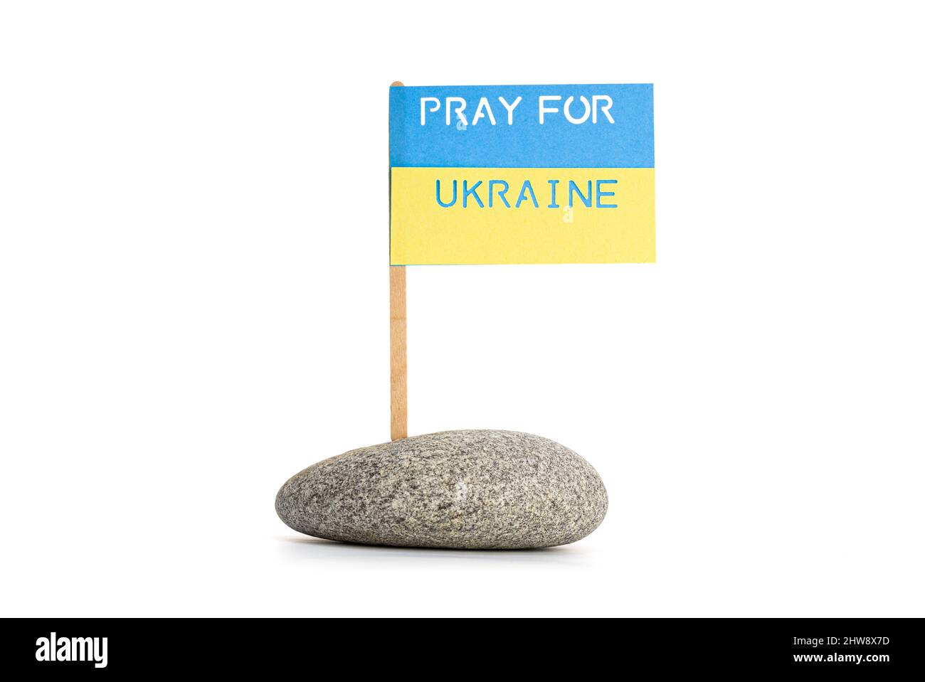 Pray for Ukraine message on Flag of Ukraine isolated on white background Stock Photo