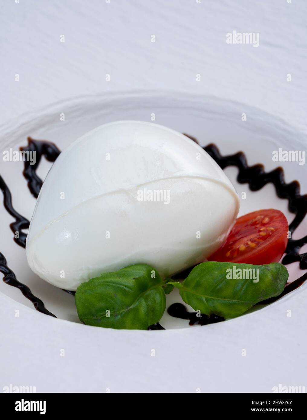 Tasing of fresh italian cheese mozzarella di buffalo with Balsamic ...