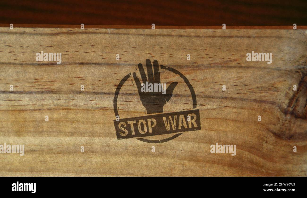 Stop war stamp printed on wooden box. Peace, no aggression and pacifism concept Stock Photo