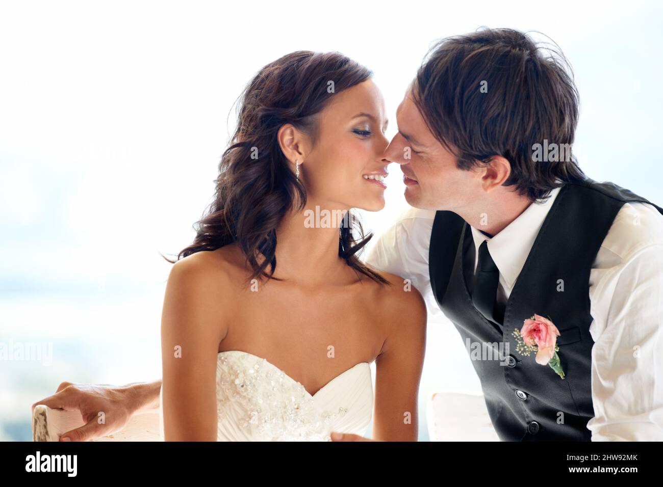 As in love as day 1. A happy newlywed couple kissing. Stock Photo