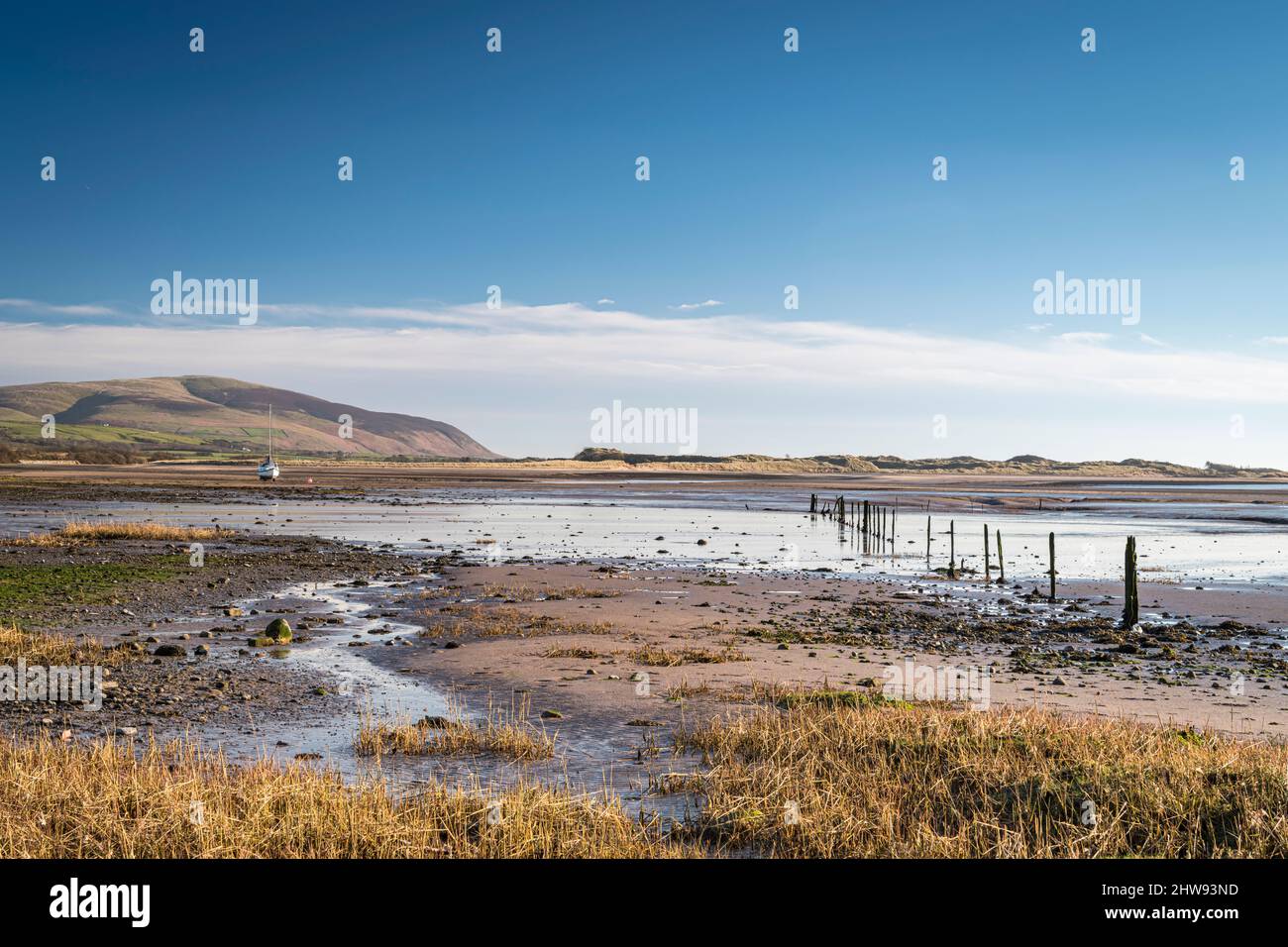 A peaceful, sunny, winter full frame HDR landscape image of Saltcoats bay at low tide near Ravenglass, Cumbria, England. 01 March 2022 Stock Photo