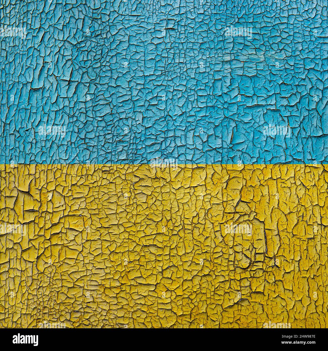 Flag of Ukraine on a cracked grunge background. Square background. Stock Photo