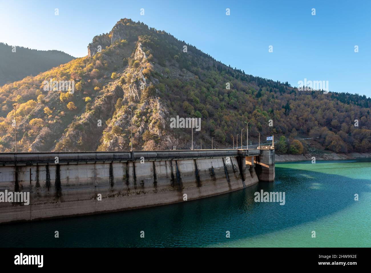 The Plastiras Dam, a concrete arch dam in Karditsa regional unit, Greece that impounds the Tavropos River, creating the artificial lake Plastiras. Stock Photo