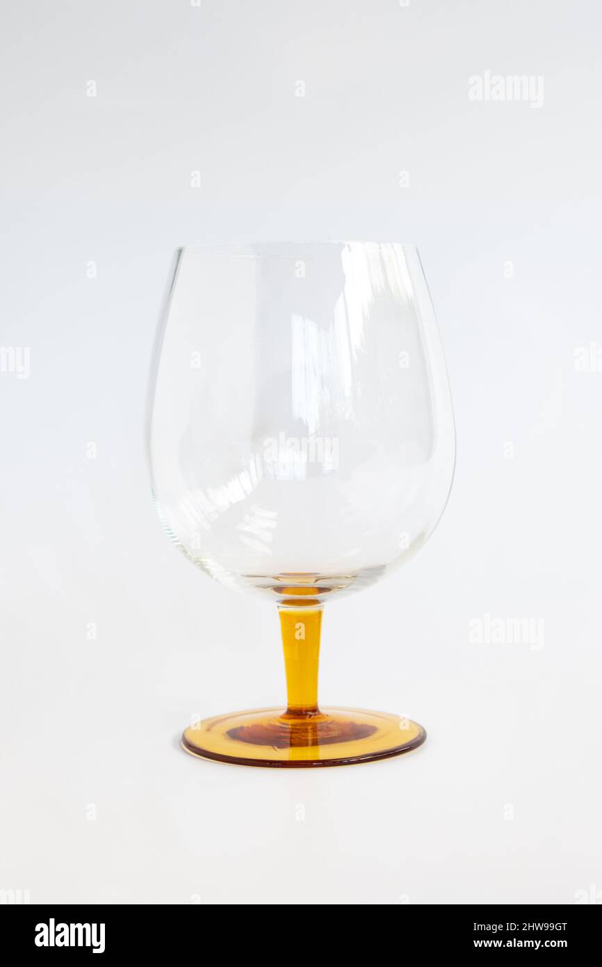 vintage brandy or cognac glass with amber coloured stem Stock Photo Alamy