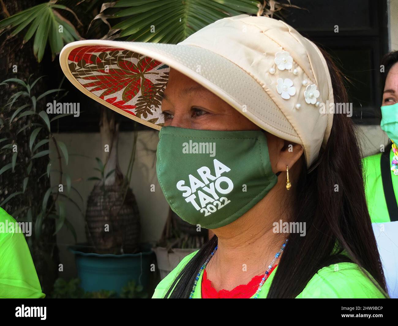 A supporter wears a facemask with SARA TAYO 2022 imprint on it. Presidential daughter and Davao City Mayor Sara Duterte-Carpio visit Navotas City. It is the UniTeam's northern Metro Manila campaign swing. The Vice Presidential aspirant was also the chairperson of the Lakas-Christian Muslim Democrats (CMD) party. Her Presidential running mate Ferdinand 'Bongbong' Marcos Jr. was not present because of a campaign sortie in the province of Sorsogon. Stock Photo