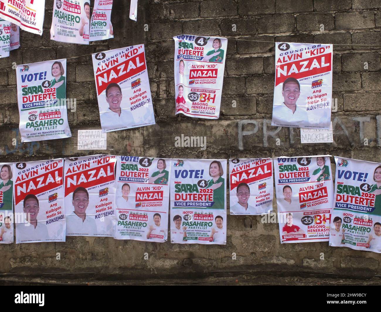 Different kinds of campaign posters are seen hanging at the Nazal Compound. Presidential daughter and Davao City Mayor Sara Duterte-Carpio visit Navotas City. It is the UniTeam's northern Metro Manila campaign swing. The Vice Presidential aspirant was also the chairperson of the Lakas-Christian Muslim Democrats (CMD) party. Her Presidential running mate Ferdinand 'Bongbong' Marcos Jr. was not present because of a campaign sortie in the province of Sorsogon. Stock Photo