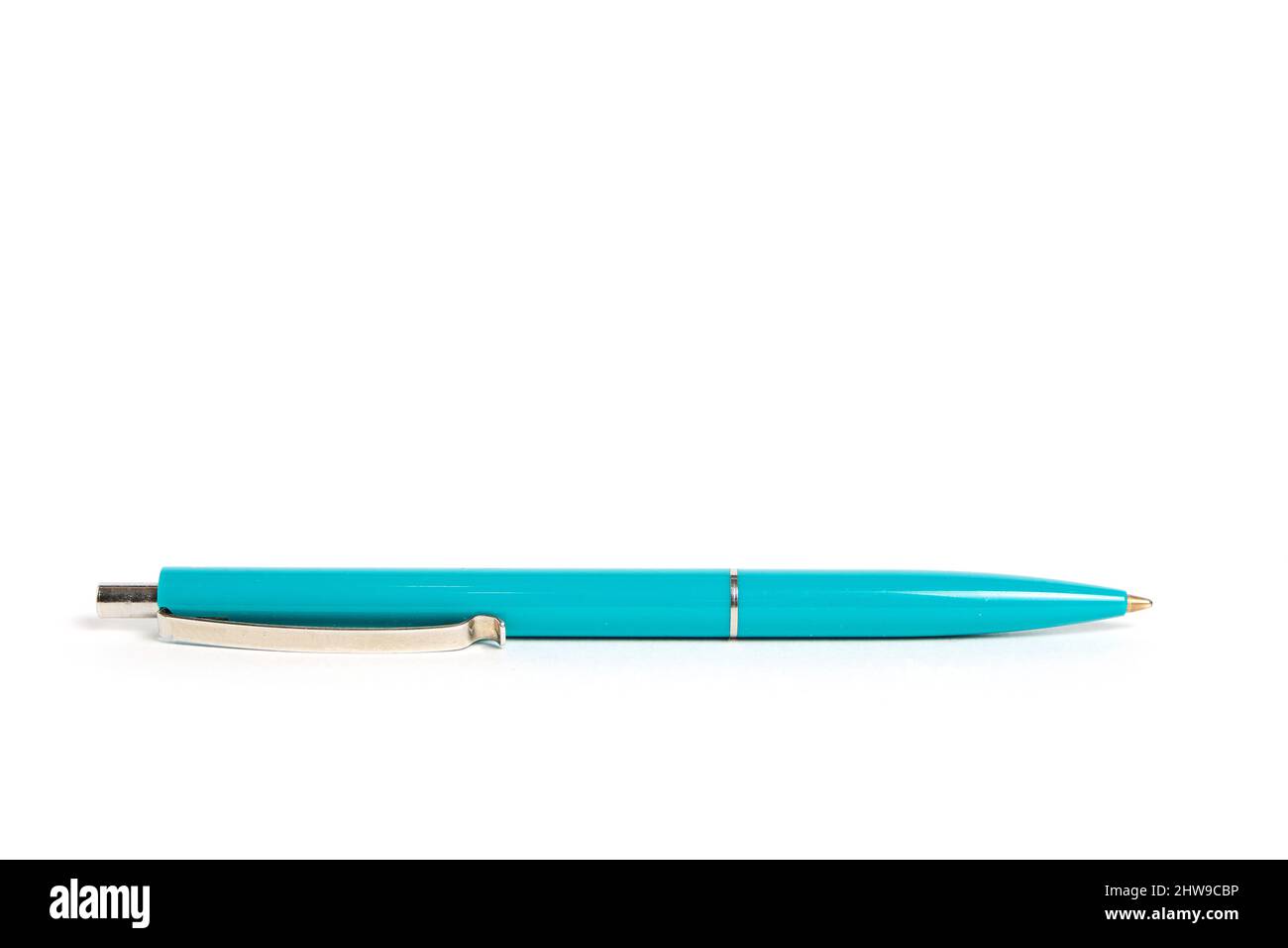 Green ballpoint pen on a white background Stock Photo