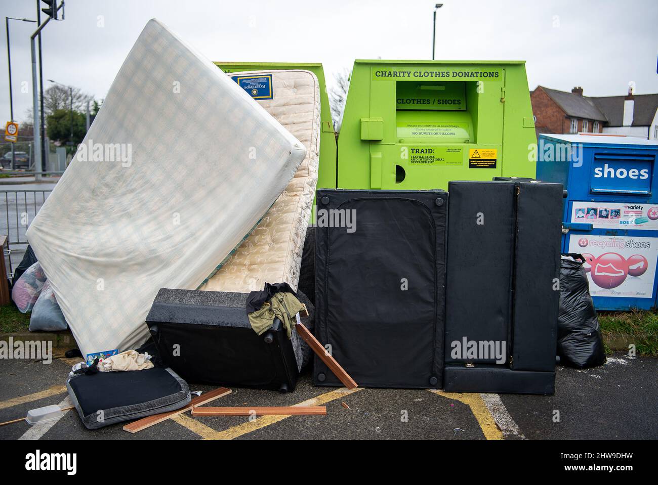 Slough, Berkshire, UK. 4th March, 2022. Illegal fly tipping in a car park next to a charitable donation collection point in Slough, which has been found to be the worst town in Berkshire for illegal fly tipping. Credit: Maureen McLean/Alamy Live News Stock Photo