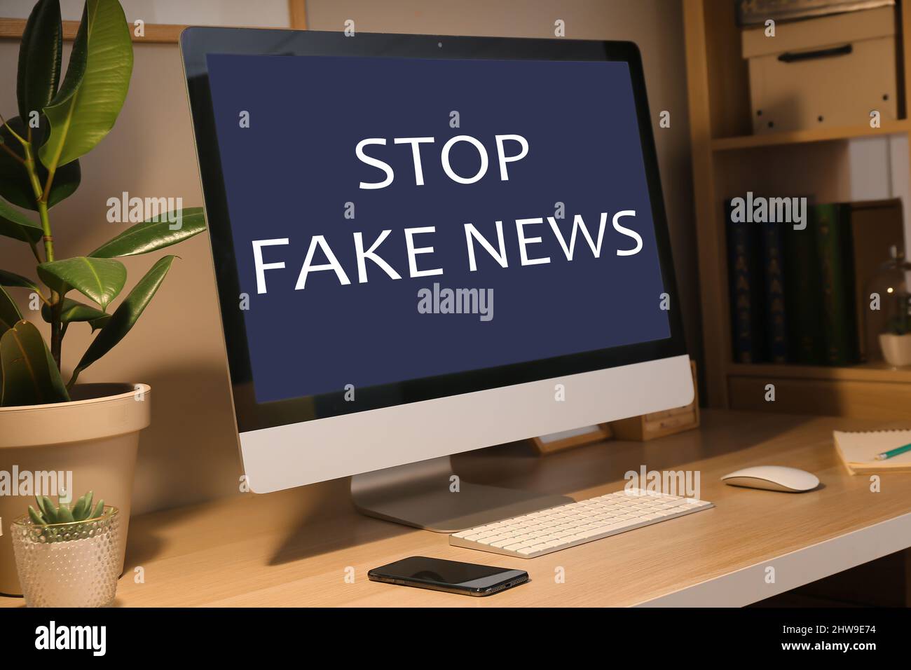 Text STOP FAKE NEWS on screen of computer monitor on table Stock Photo ...