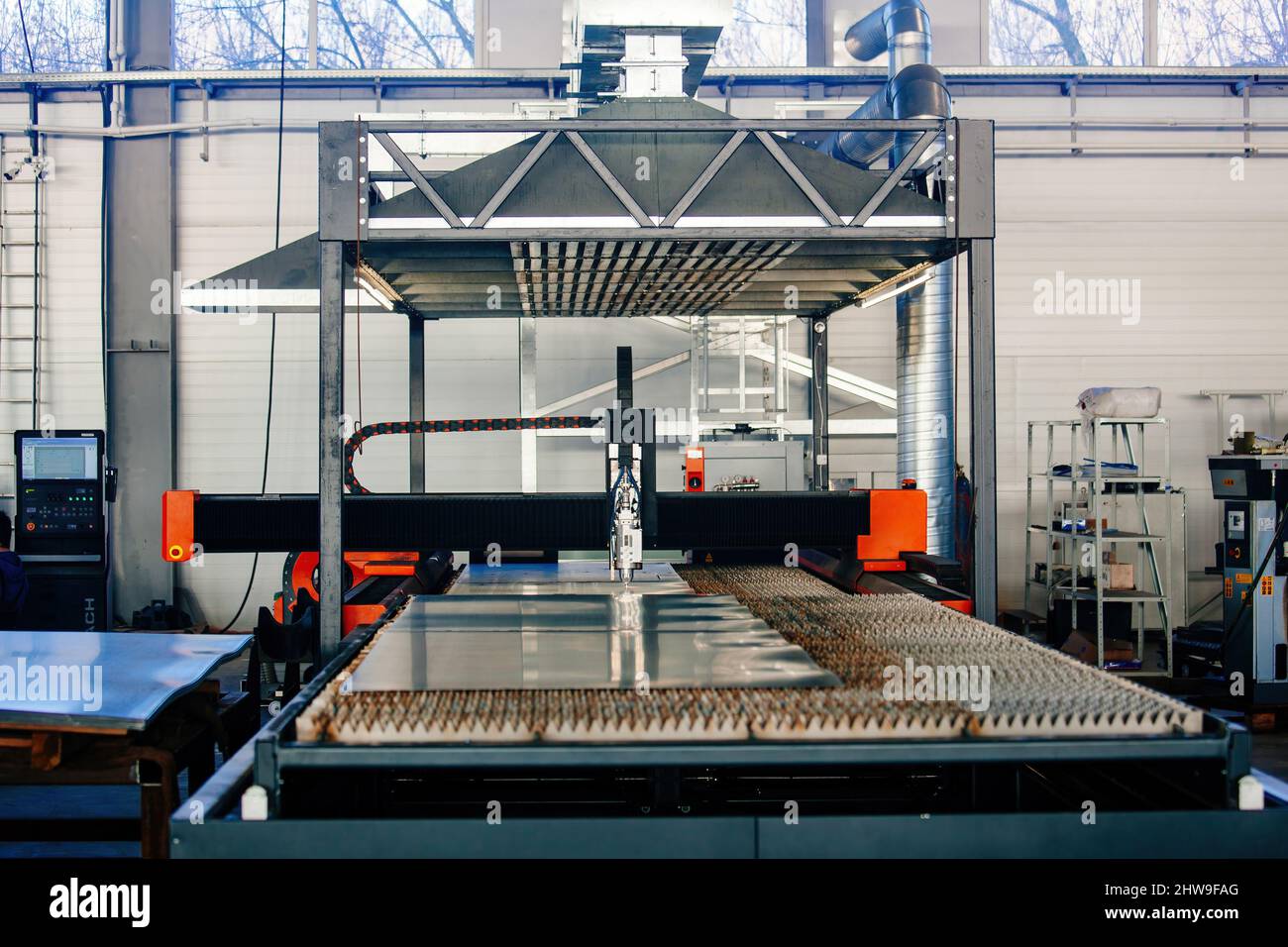 Laser cutting machine with CNC is cutting the steel sheet Stock Photo