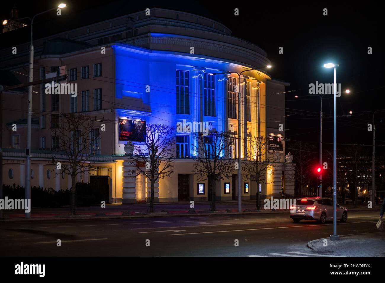 Estonian National Opera Theatre building at night in Ukrainian flag colours. Showing support for Ukraine. Stock Photo