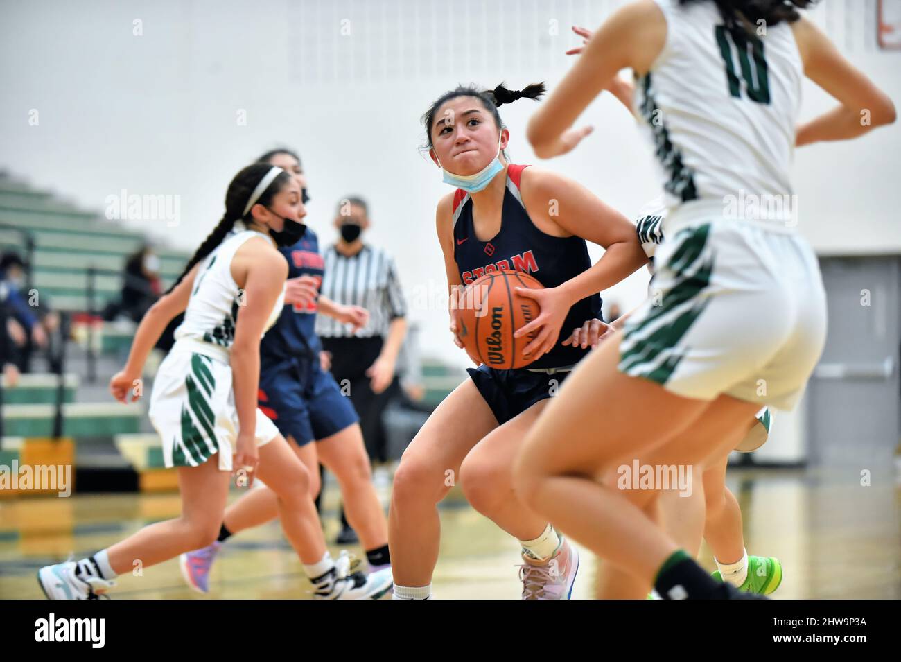 USA. Player driving on the basket while eyeing the hoop. Stock Photo
