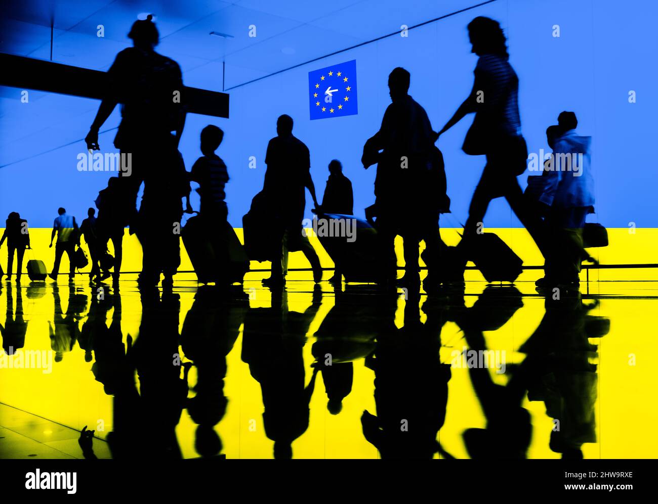 People and children with suitcases, flag of Ukraine overlayed. Russia Ukraine conflict war, refugees, EU, border control, Russian sanctions concept. Stock Photo