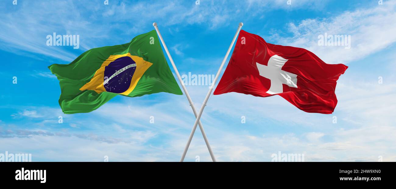 crossed national flags of Brazil and switzerland flag waving in the ...