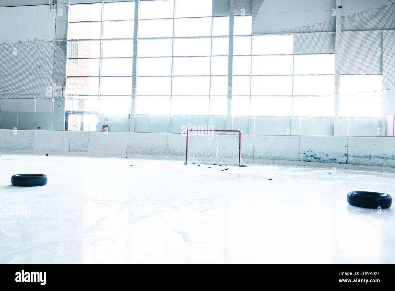 ice hockey ice rink and empty red net Stock Photo Alamy