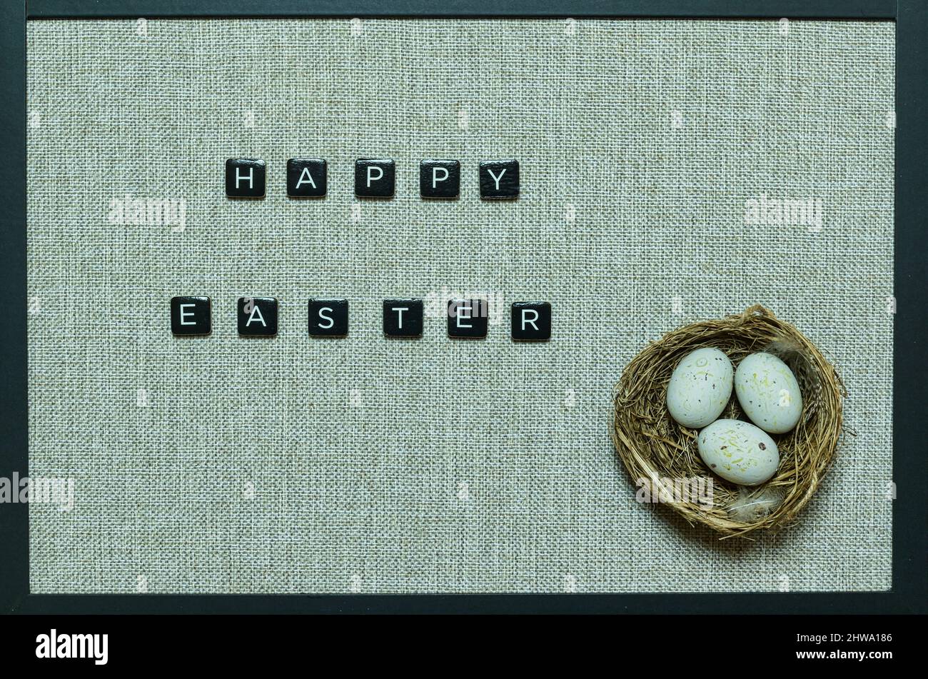 happy easter wishes with nest and eggs Stock Photo