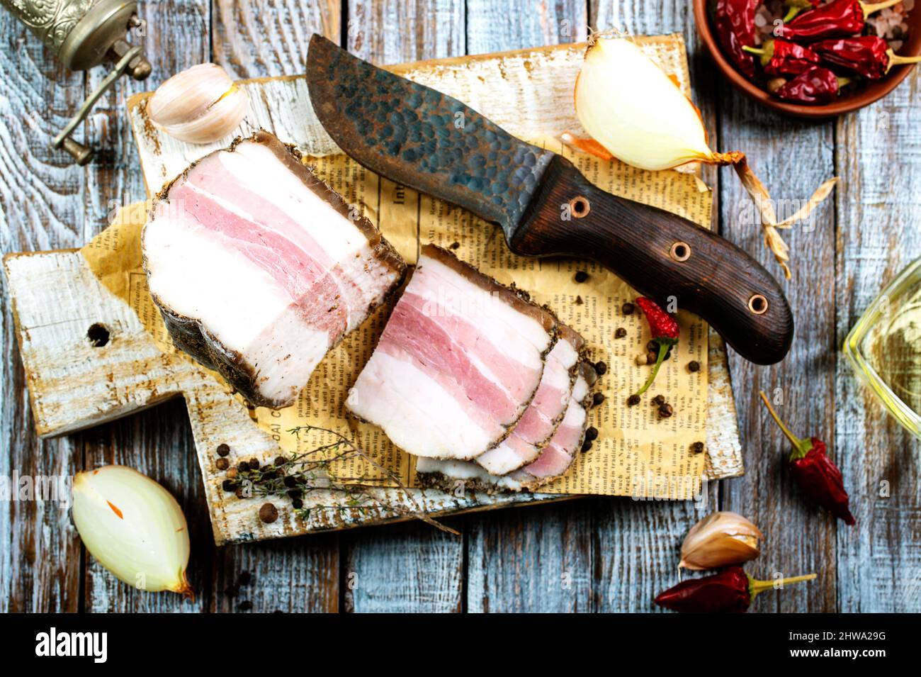 Chunks of salted bacon on dark background. Healthy food with pranami