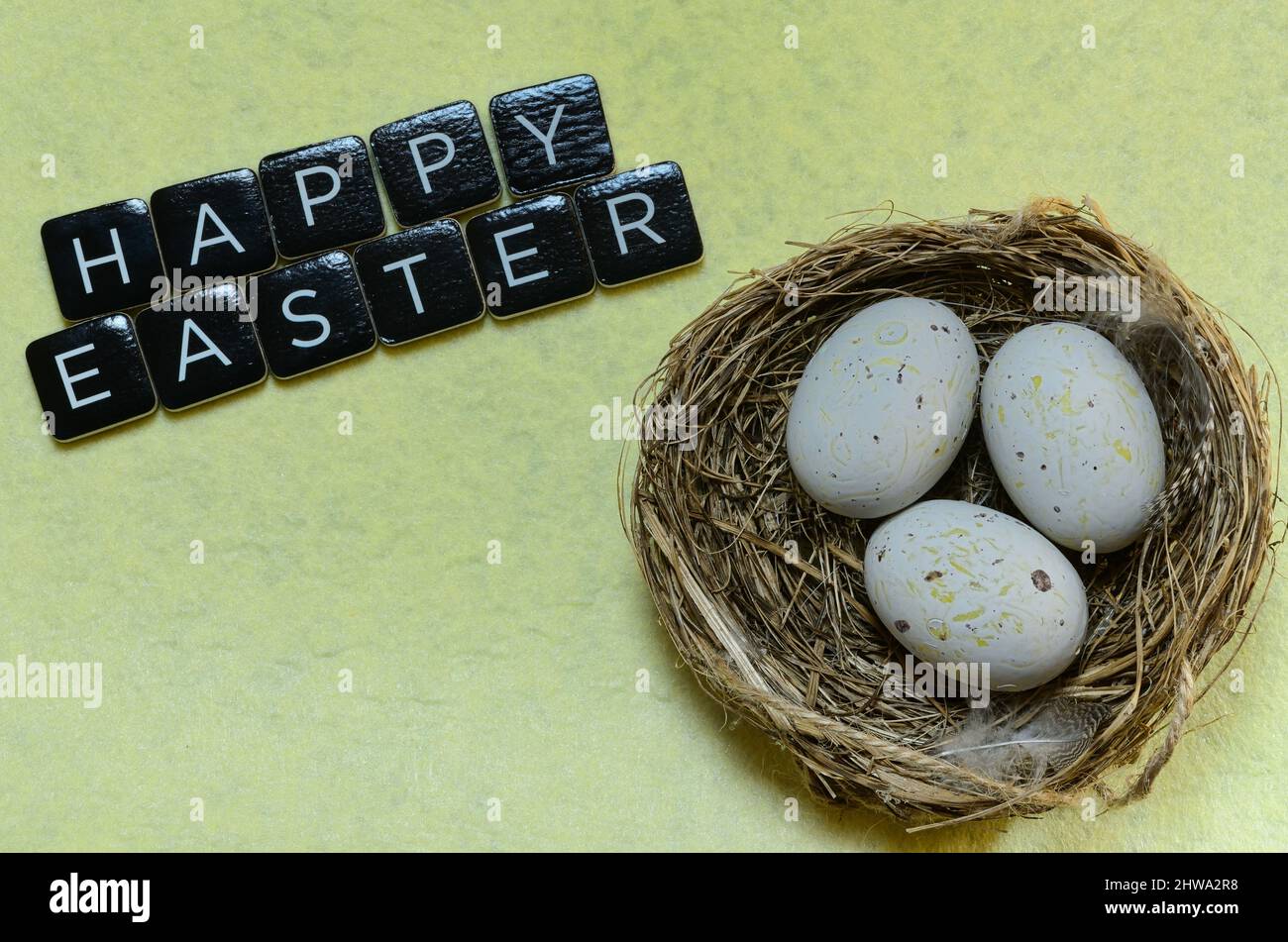 happy easter wishes with nest and eggs Stock Photo