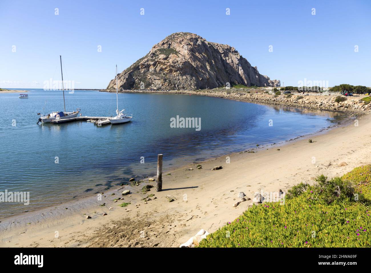 Morro Bay Rock and Harbor or Harbour Beach Landscape View with moored Yacht Boats along Scenic Pacific Ocean California Coastline Stock Photo