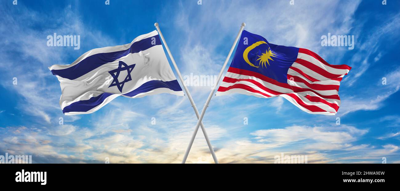 crossed national flags of Israel and Malaysia flag waving in the wind ...