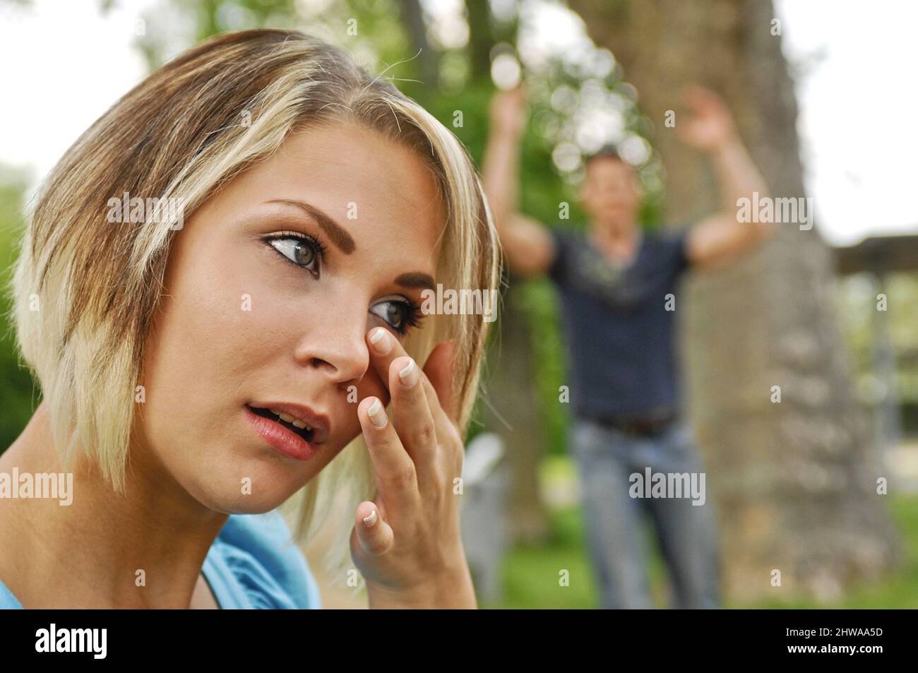 couple arguing, he gets upset, she cries Stock Photo