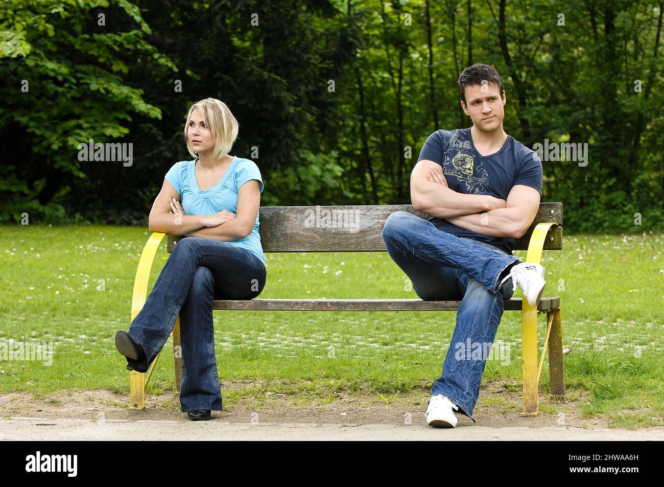 quarrelling couple sitting on a bench and has nothing more to say to each other Stock Photo