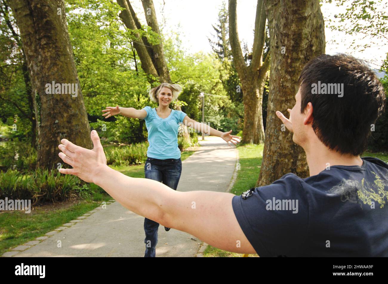couple in love greeting each other in the park Stock Photo