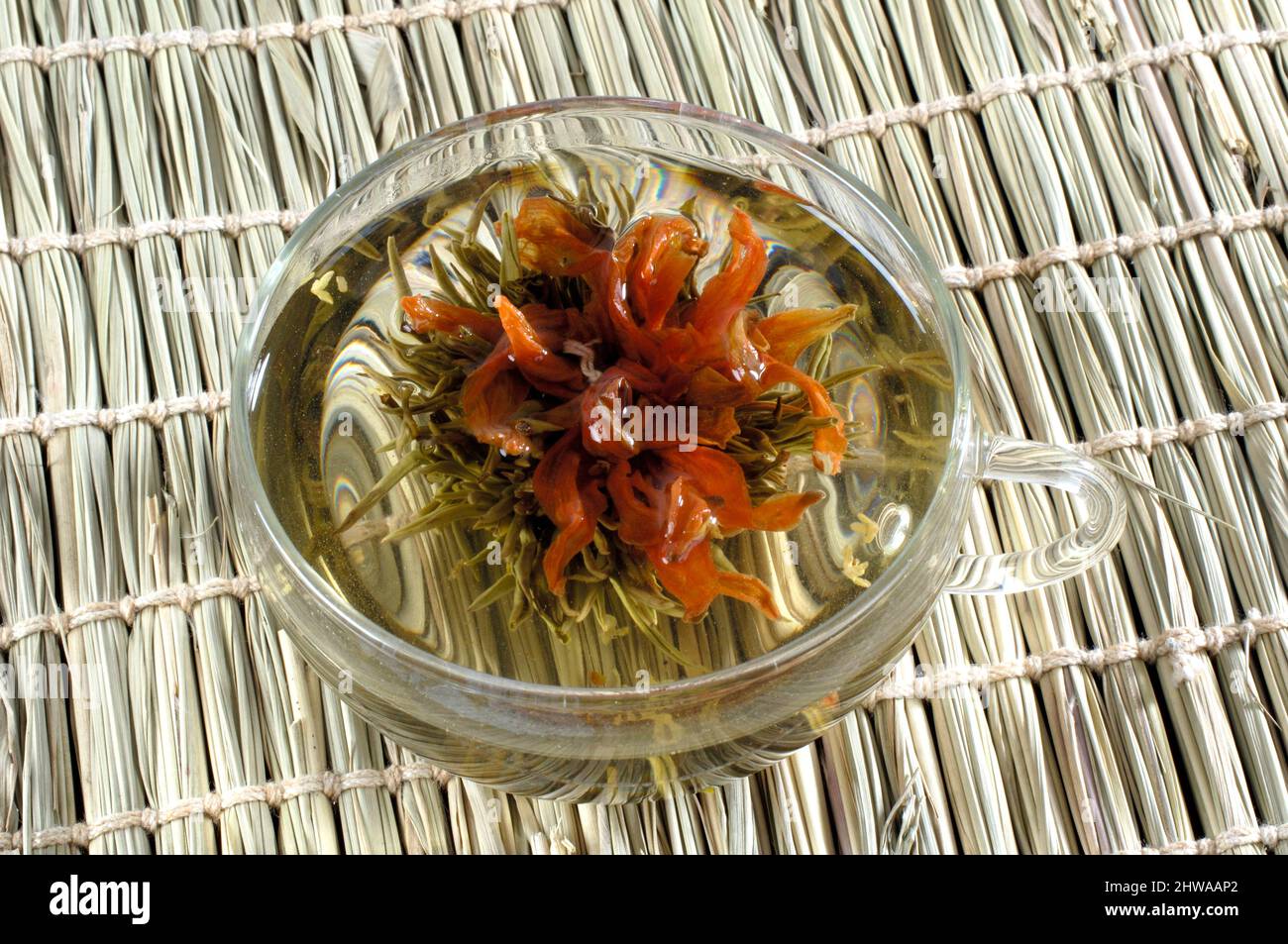 Tea flowers in a tea cup, flowers blossom tea, Green Tea Sweet Osmanthus Stock Photo