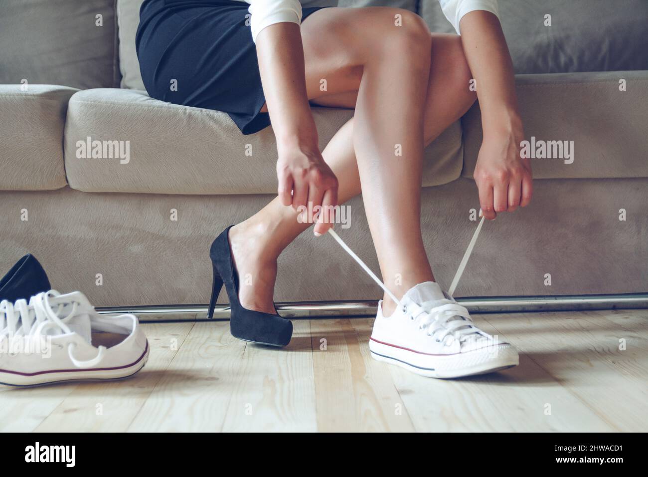 woman makes the choice between comfortable and shoes