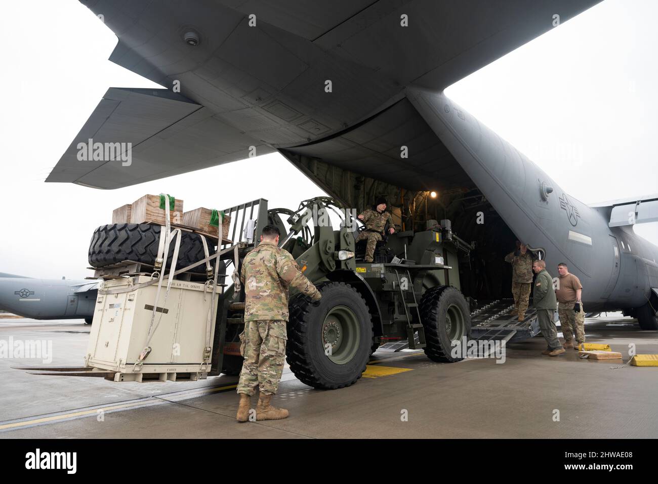 Ramstein Air Base, Germany. 4th Feb, 2022. U.S. Air Force Airmen assigned to the 86th Airlift Wing load supplies onto a C-130J Super Hercules aircraft at Ramstein Air Base, Germany, Feb. 4, 2022. A small element of 435th Contingency Response Group personnel have deployed to Poland, at their government's request, to prepare to assist humanitarian efforts resulting from a possible Russian incursion into Ukraine. Credit: U.S. Army/ZUMA Press Wire Service/ZUMAPRESS.com/Alamy Live News Stock Photo