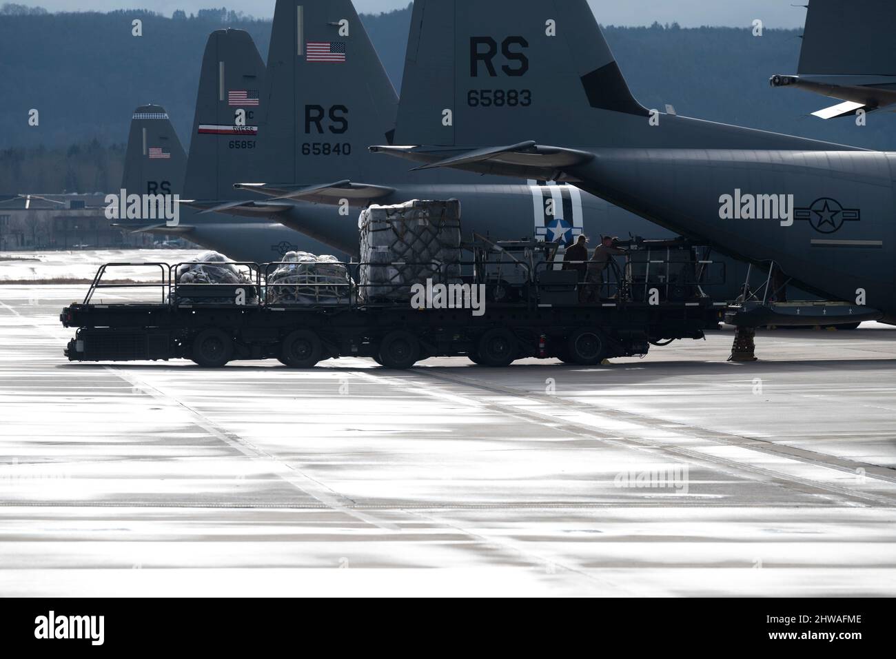 Ramstein Air Base, Germany. 4th Feb, 2022. A 40K Tunner loader moves baggage and supplies onto a C-130J Super Hercules aircraft at Ramstein Air Base, Germany, Feb. 4, 2022. U.S. Air Forces in Europe ''“ Air Forces Africa forces are prepared and strategically positioned to rapidly surge forces into and across the theater in order to support the alliance and defend against any aggression. Credit: U.S. Air Force/ZUMA Press Wire Service/ZUMAPRESS.com/Alamy Live News Stock Photo