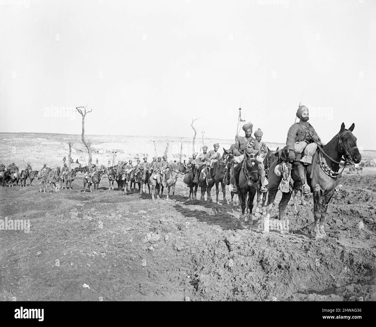 Troops of the 29th Lancers Regiment (Deccan Horse) near Pys, armed with lances and making their way through a shell torn landscape, March 1917. Stock Photo