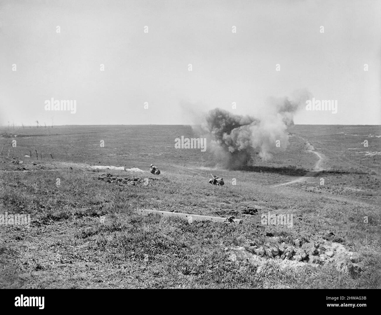 Second Battle of the Somme 1918. German shell burst showing two soldiers ducking in foreground. Near Courcelles, 21 August 1918. Stock Photo