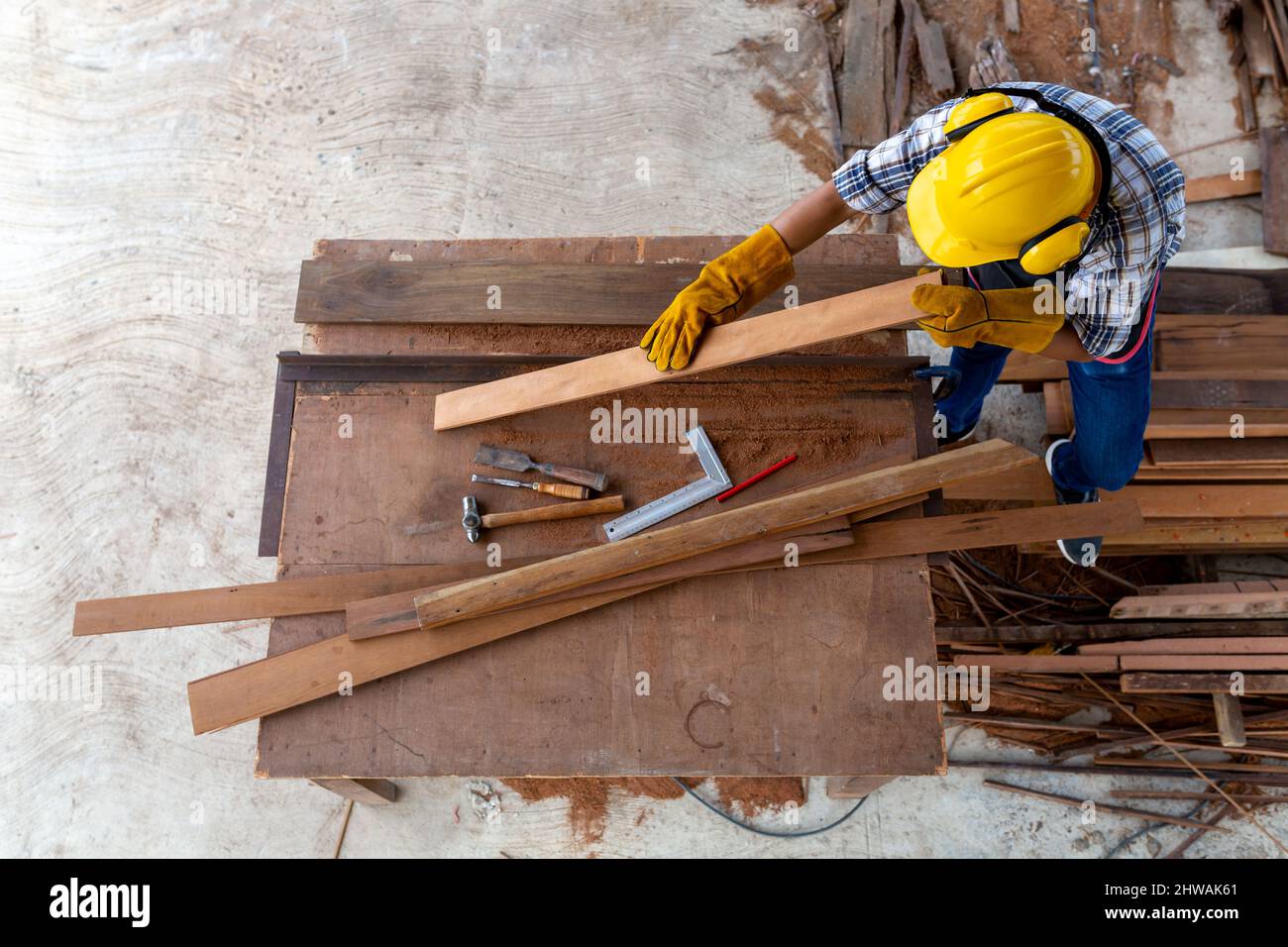 Aerial view of ccarpenter working in construction site Stock Photo - Alamy