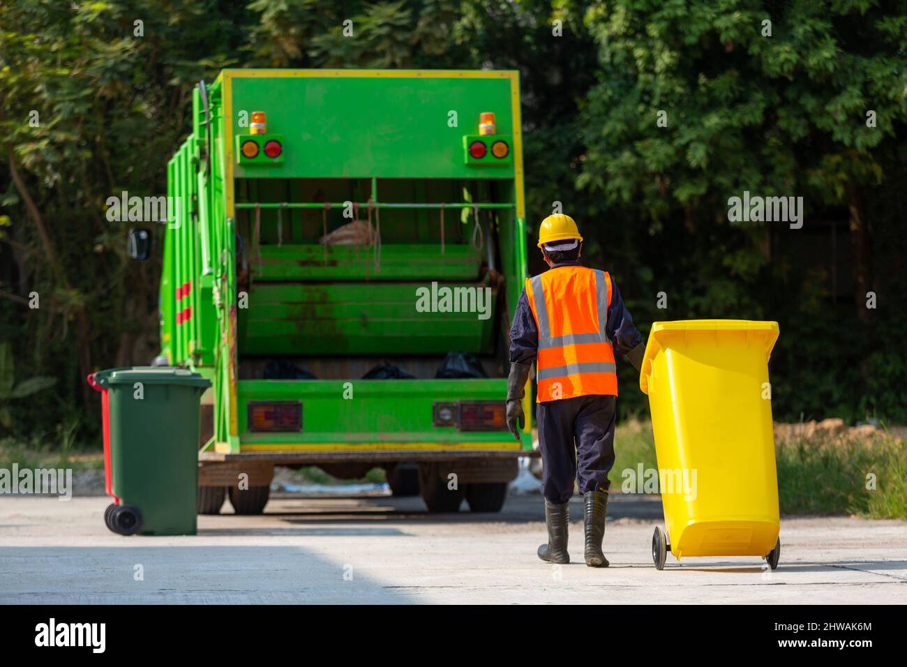 Garbage collector, Workers collect garbage with Garbage collection truck Stock Photo
